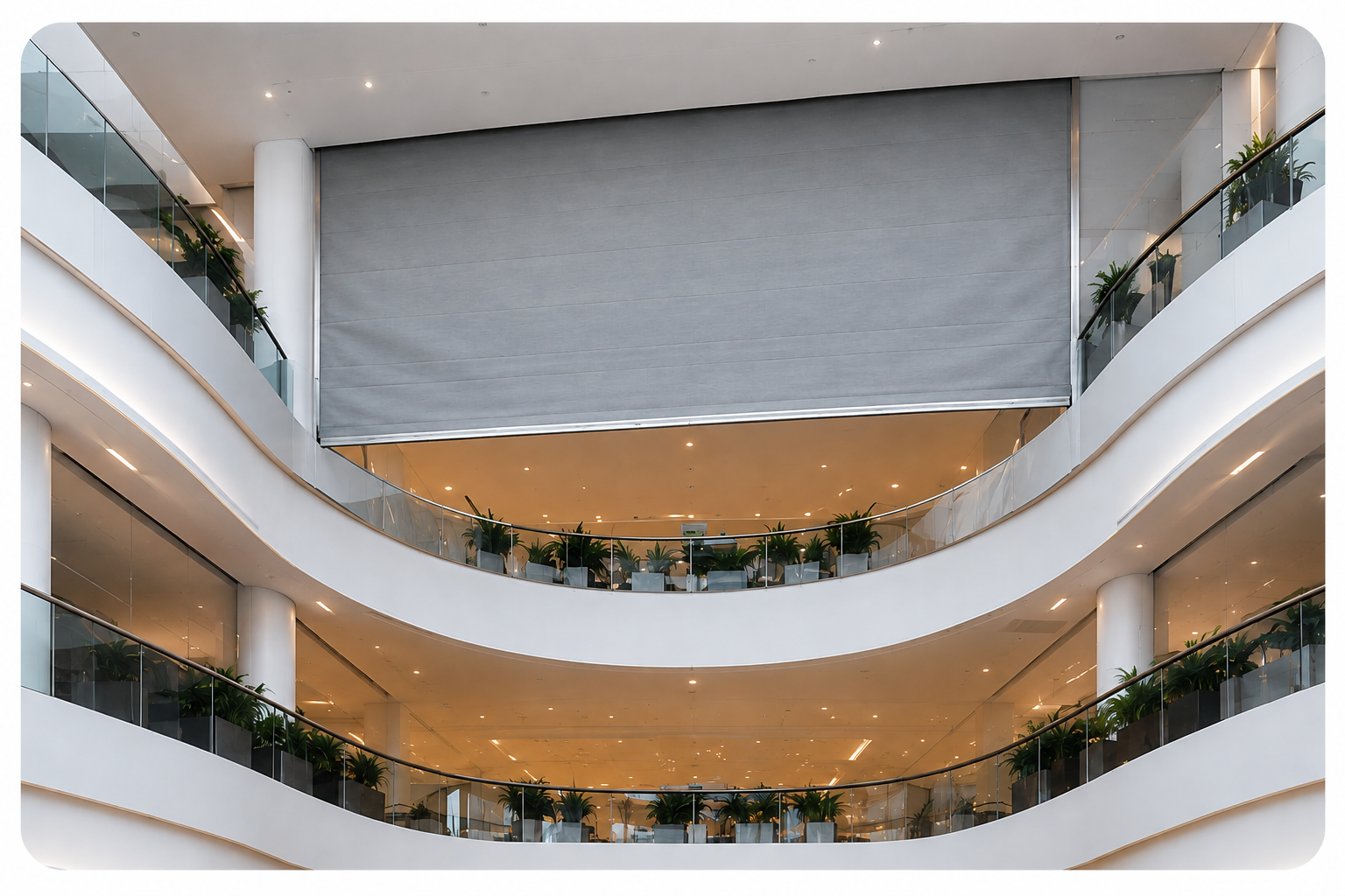Fire curtain deployed across a multi-storey atrium opening